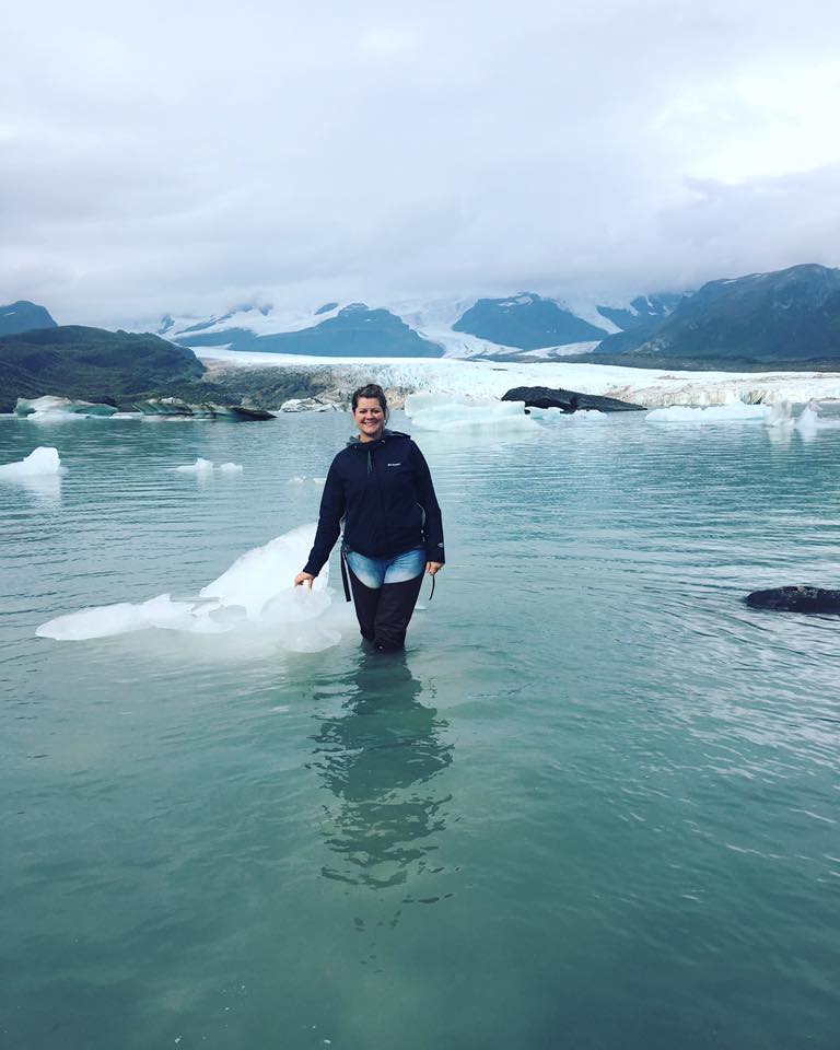 Chastity standing in glacier water