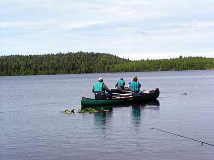 3 people on a boat fishing in Alaska