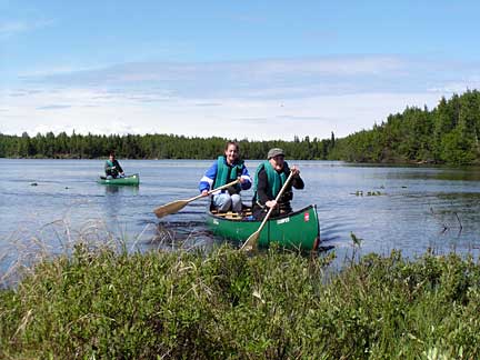 people canoeing on a lake in Alaska