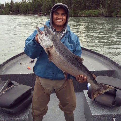 man holding a fish in Alaska