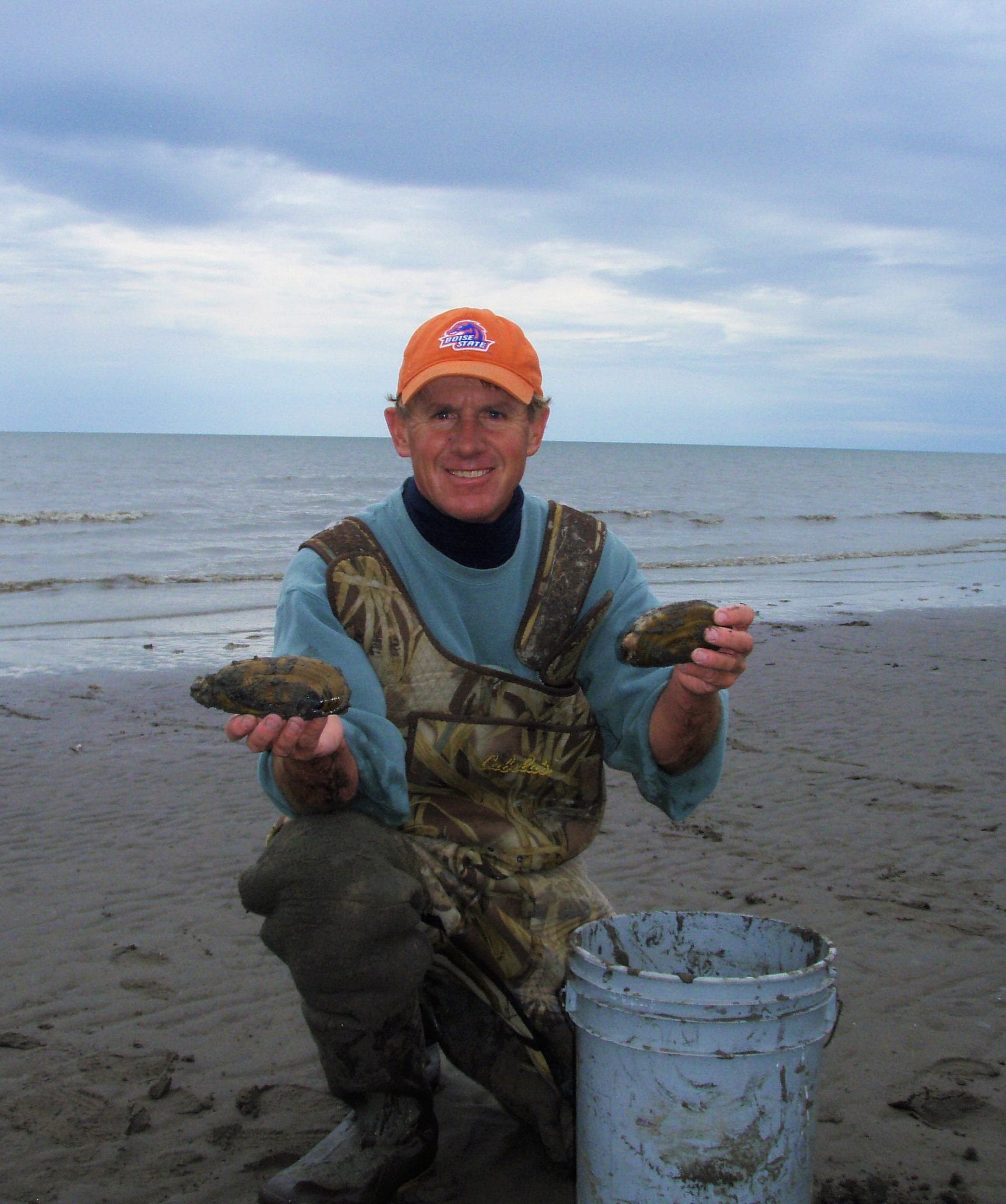 man holding clams