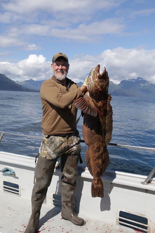 man holding large fish