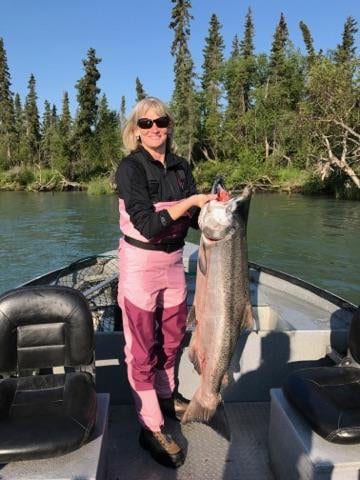 woman holding large king salmon