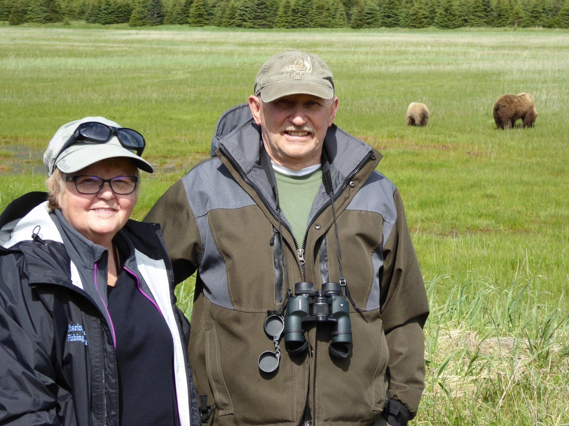 middle aged couple with binoculars