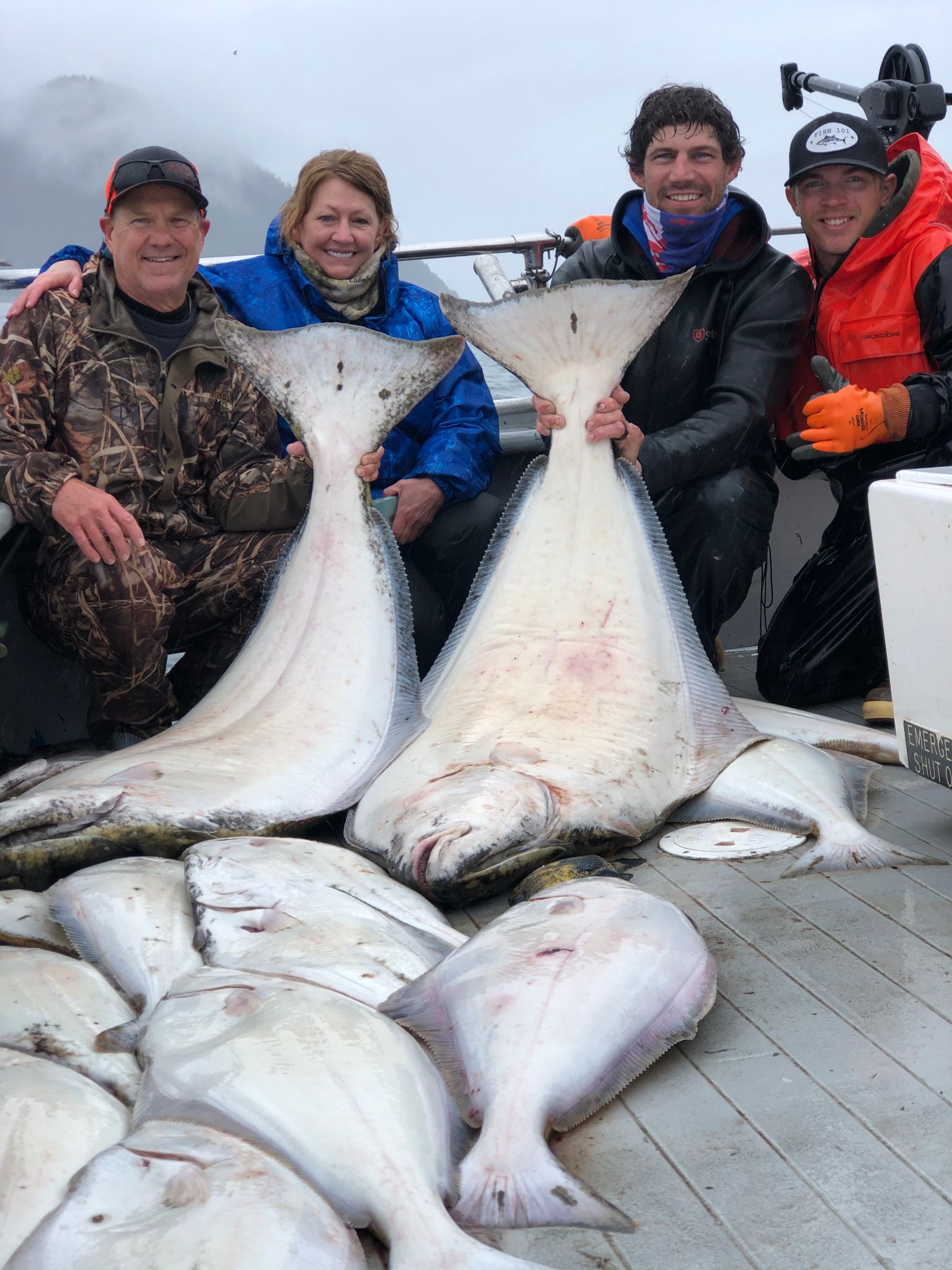 Alaska halibut fishing group with fish
