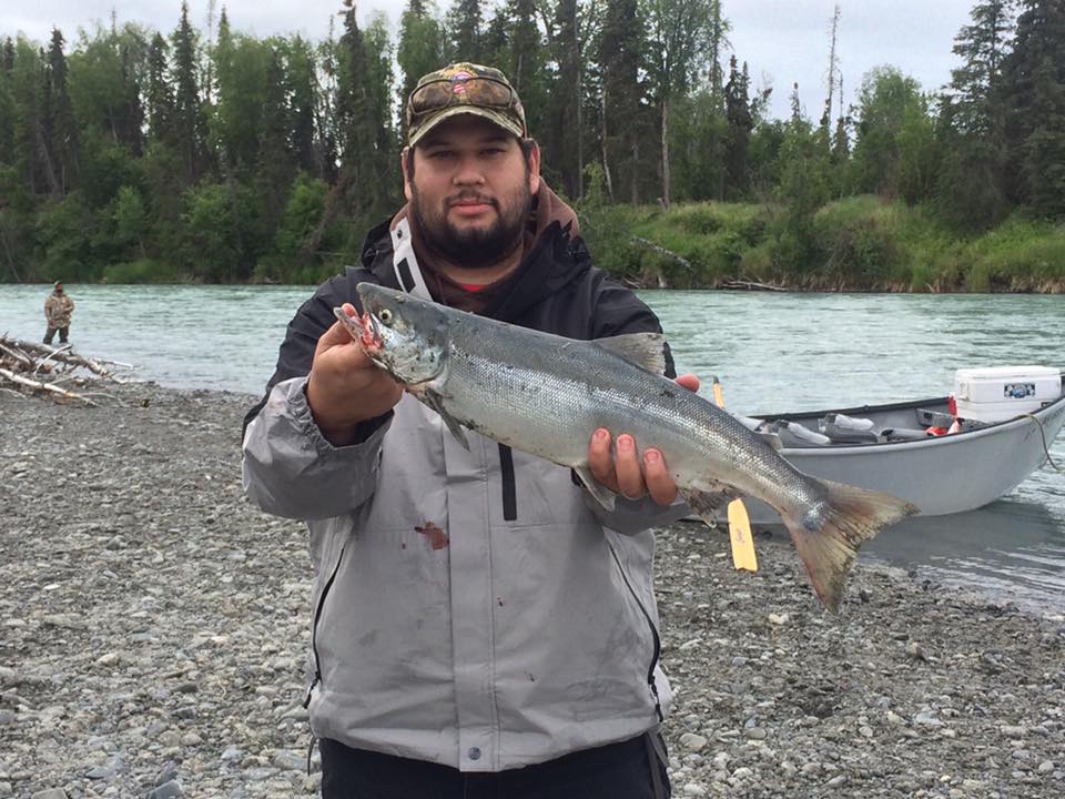 bearded guy showing off a salmon