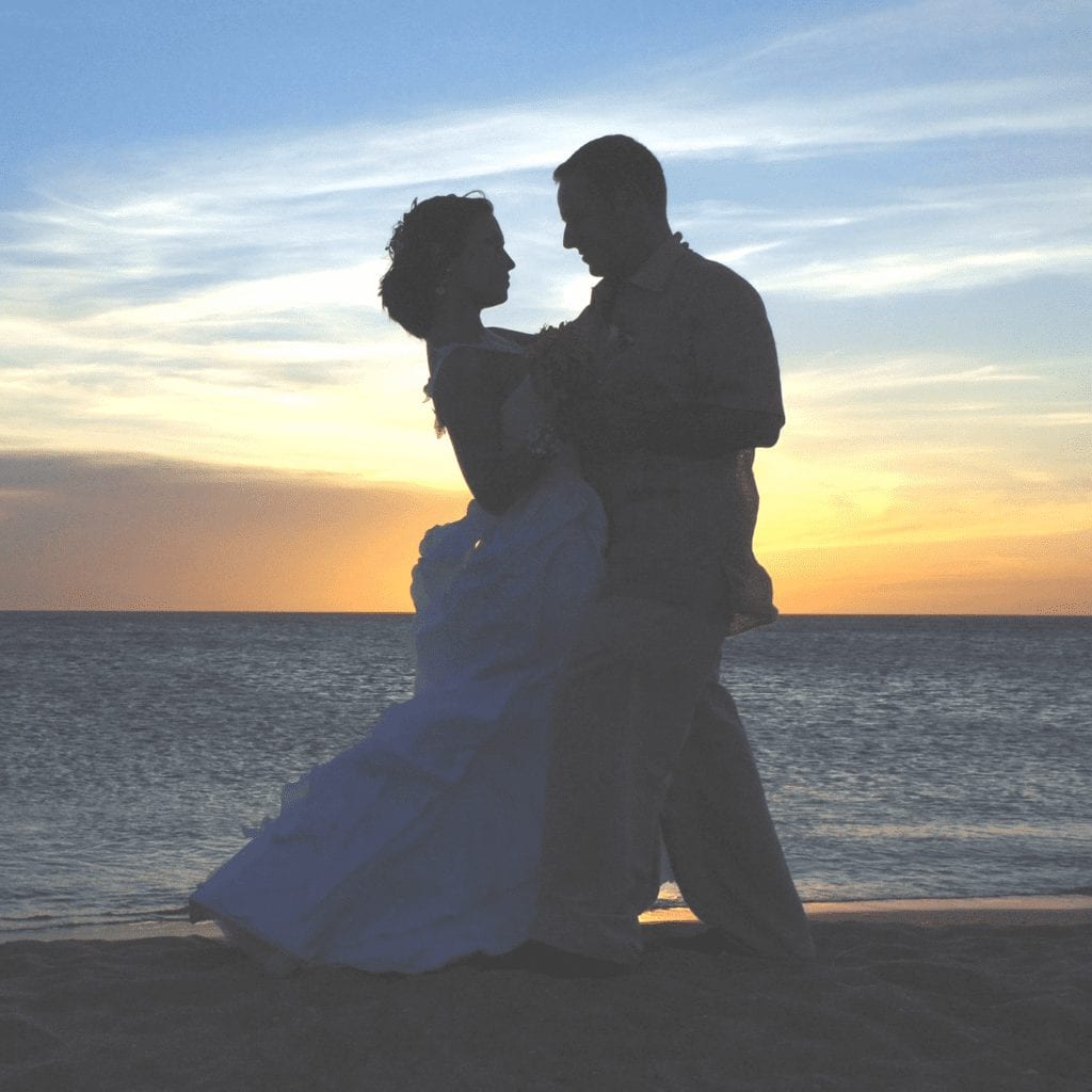 wedding couple dancing on Alaska beach