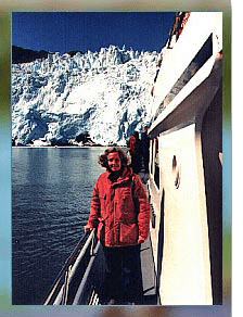 p12-c081df6a woman in red jacket on a boat at Alaska glacier