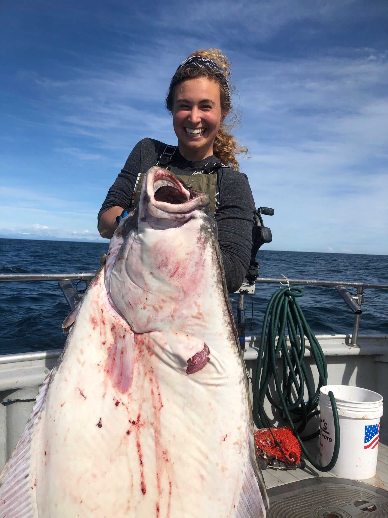 woman holding large halibut